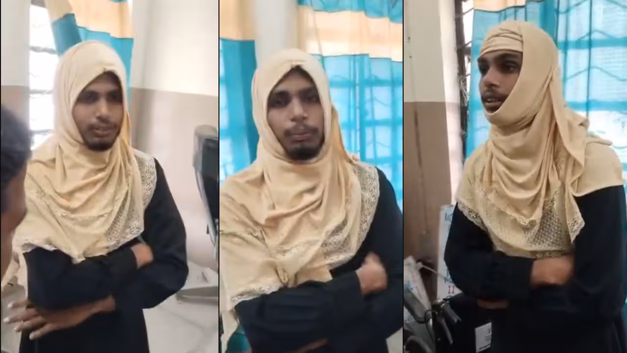 Burqa | బుర్ఖాలో యువకుడు.. బస్టాండ్లో మహిళ పక్కనే కూర్చుని..