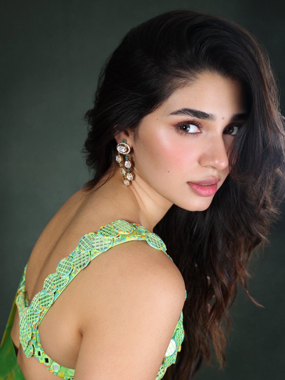 Krithi Shetty | చిలక పచ్చ చీరలో కృతి శెట్టి అందాల విందు - Image 1